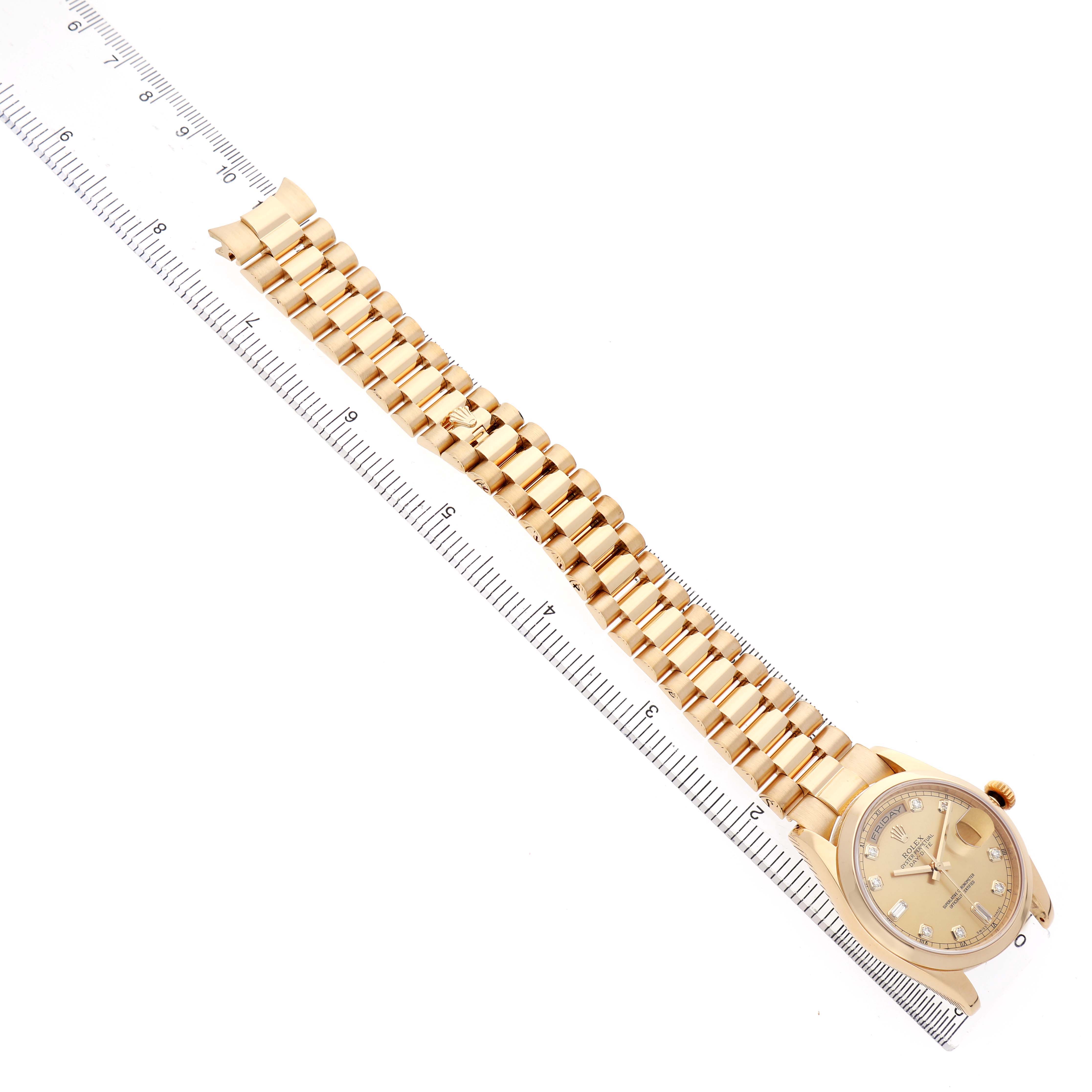 The Rolex President 118238 Men's Yellow Gold Champagne Dial watch is shown from a top-down angle, including its bracelet and bezel.