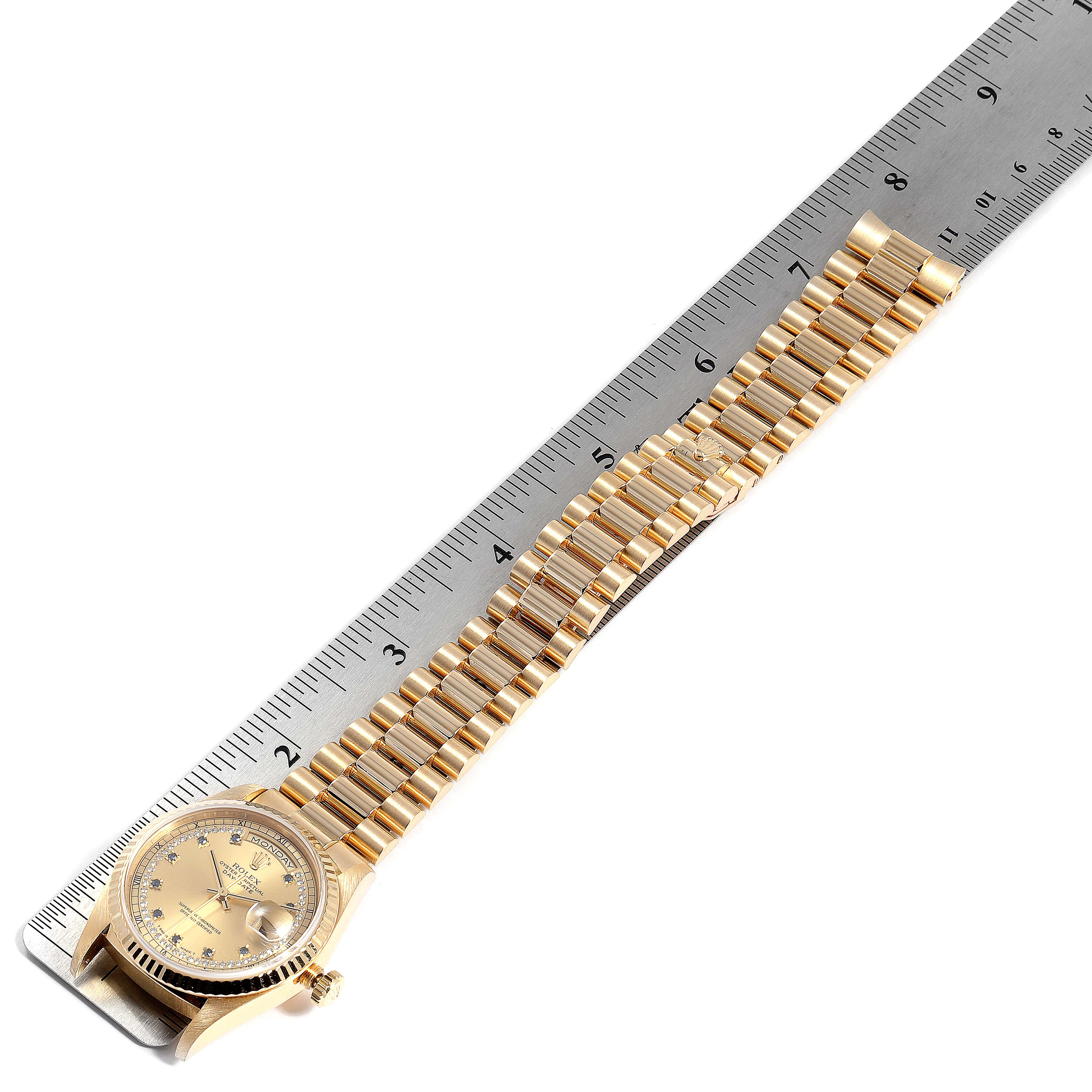 The Rolex President 18238 Men's Yellow Gold Champagne Dial 18238 Men's Yellow Gold Champagne Dial model watch is shown flat, with the dial and full bracelet visible next to a ruler for size comparison.