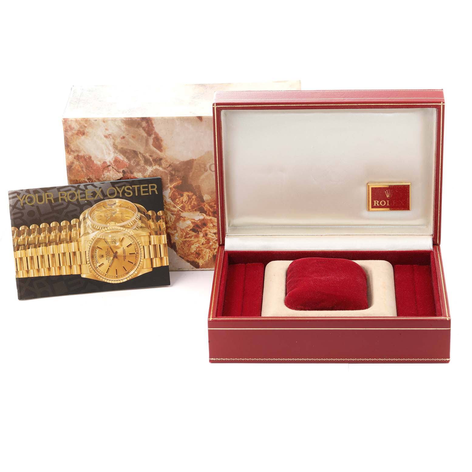 This image shows the open box and pamphlet for the Rolex President 69158 Women
s Yellow Gold Silver Dial 69158 Women
s Yellow Gold Silver Dial model watch, viewed from the front.