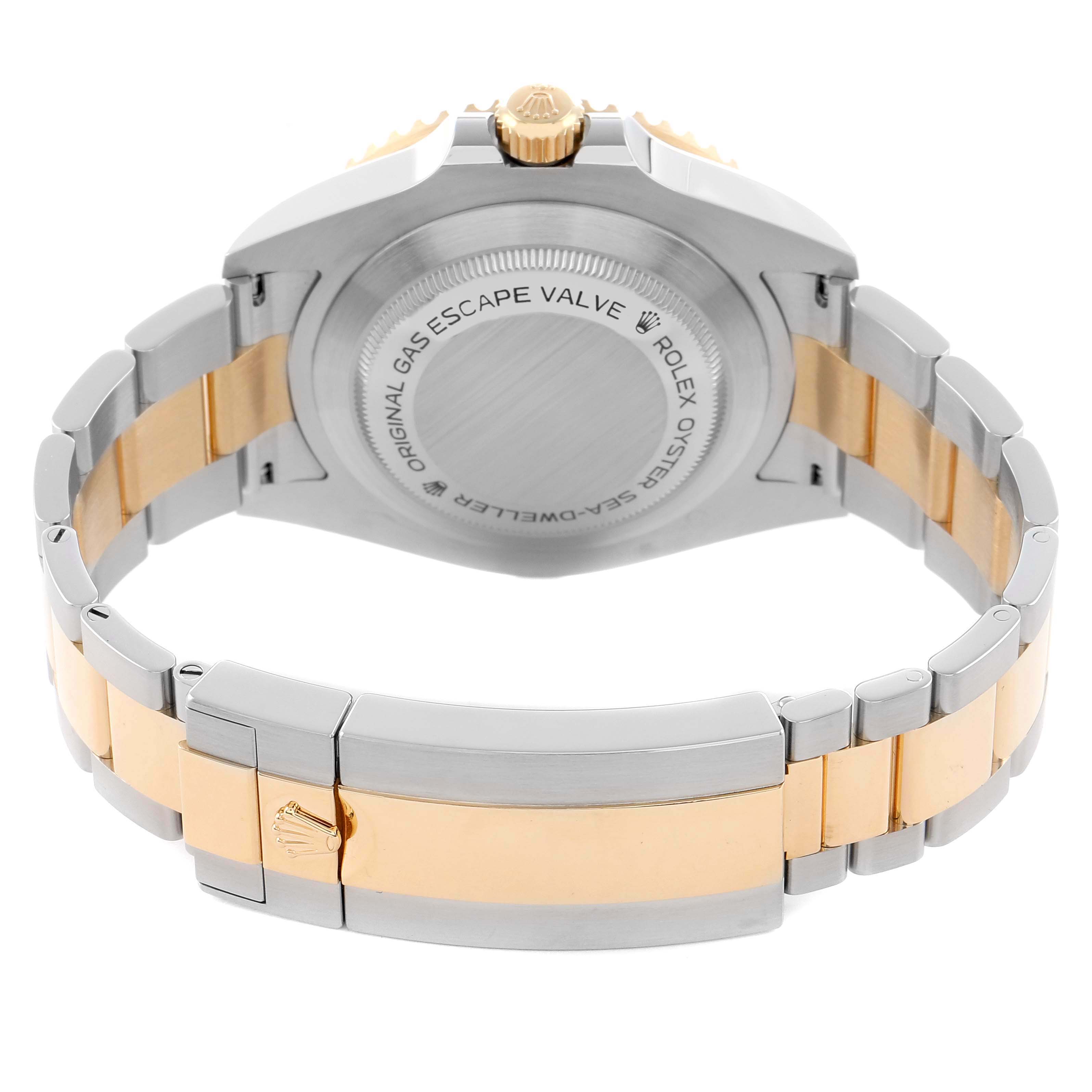 The image shows the Rolex Sea-Dweller 126603 Men
s Steel and Gold (two tone) Black Dial
s case back, crown, and bi-color bracelet from a rear angle.