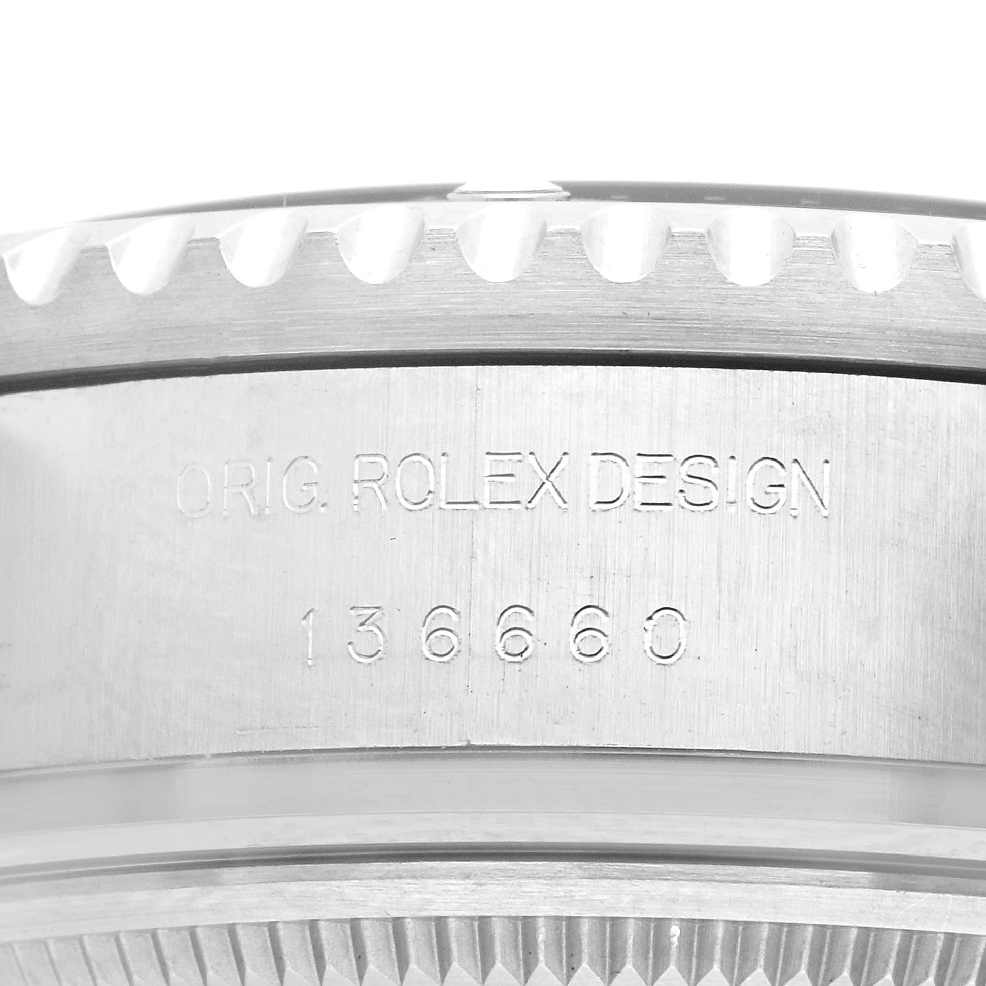 The image shows a close-up of the side of a Rolex Sea-Dweller 73113 Men
s Stainless Steel Blue Dial, focusing on the engraved design and part number.