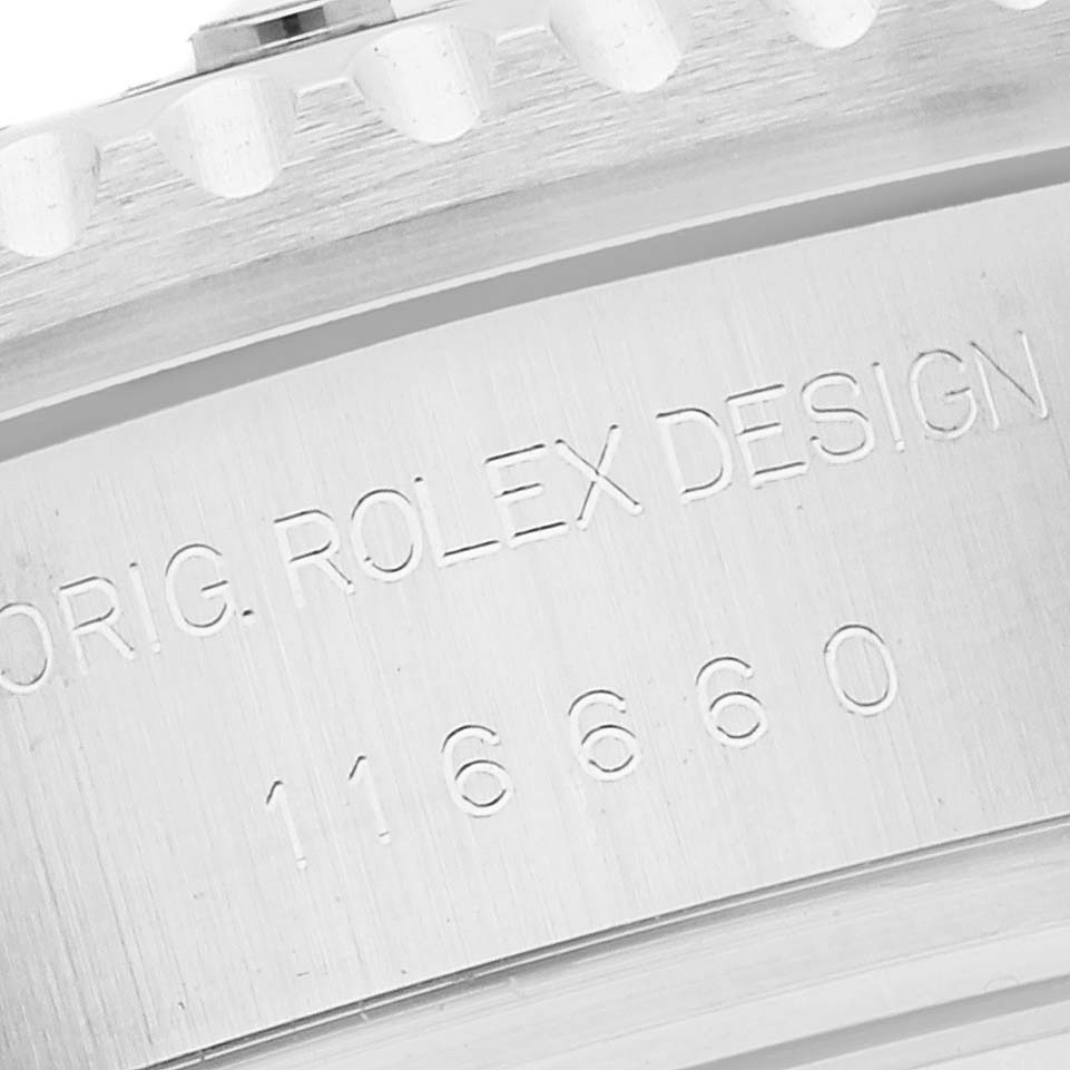 This image shows a close-up of the engraved text and the edge of the bezel on a Rolex Sea-Dweller 116660 Men
s Stainless Steel Black Dial 116660 Men
s Stainless Steel Black Dial model.