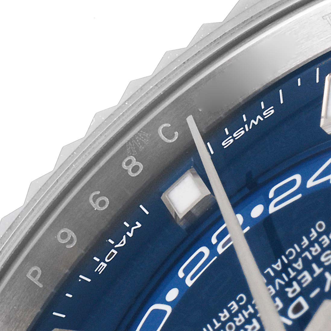This close-up image of the Rolex Sky-Dweller 326934 Men's Stainless Steel Blue Dial 326934 Men's Stainless Steel Blue Dial watch shows part of the bezel, dial, hour markers, and the "Swiss Made" text.