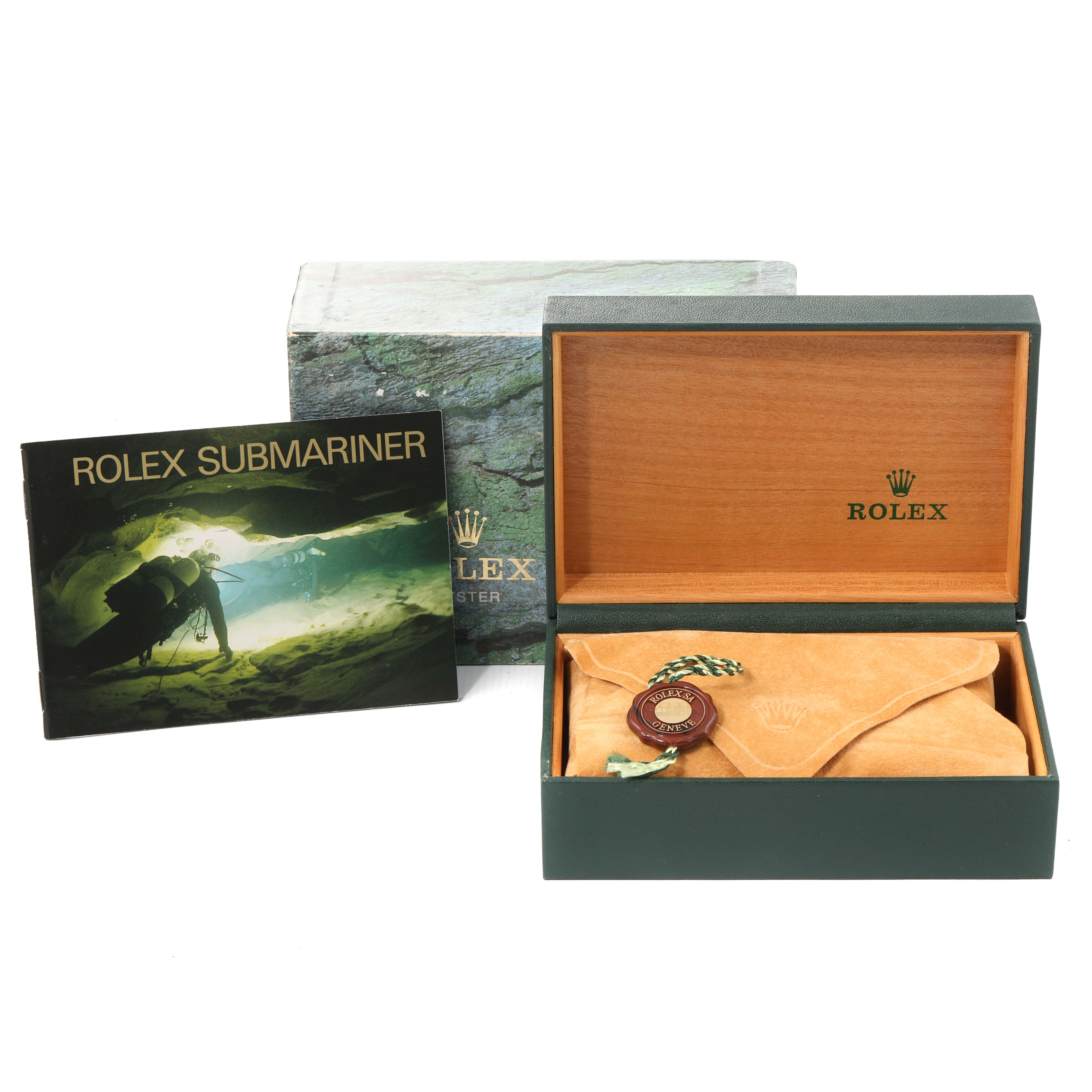 This image shows a Rolex Submariner 14060 Men
s Stainless Steel Black Dial 14060 Men
s Stainless Steel Black Dial box, a protective pouch, a tag, and an instruction booklet.