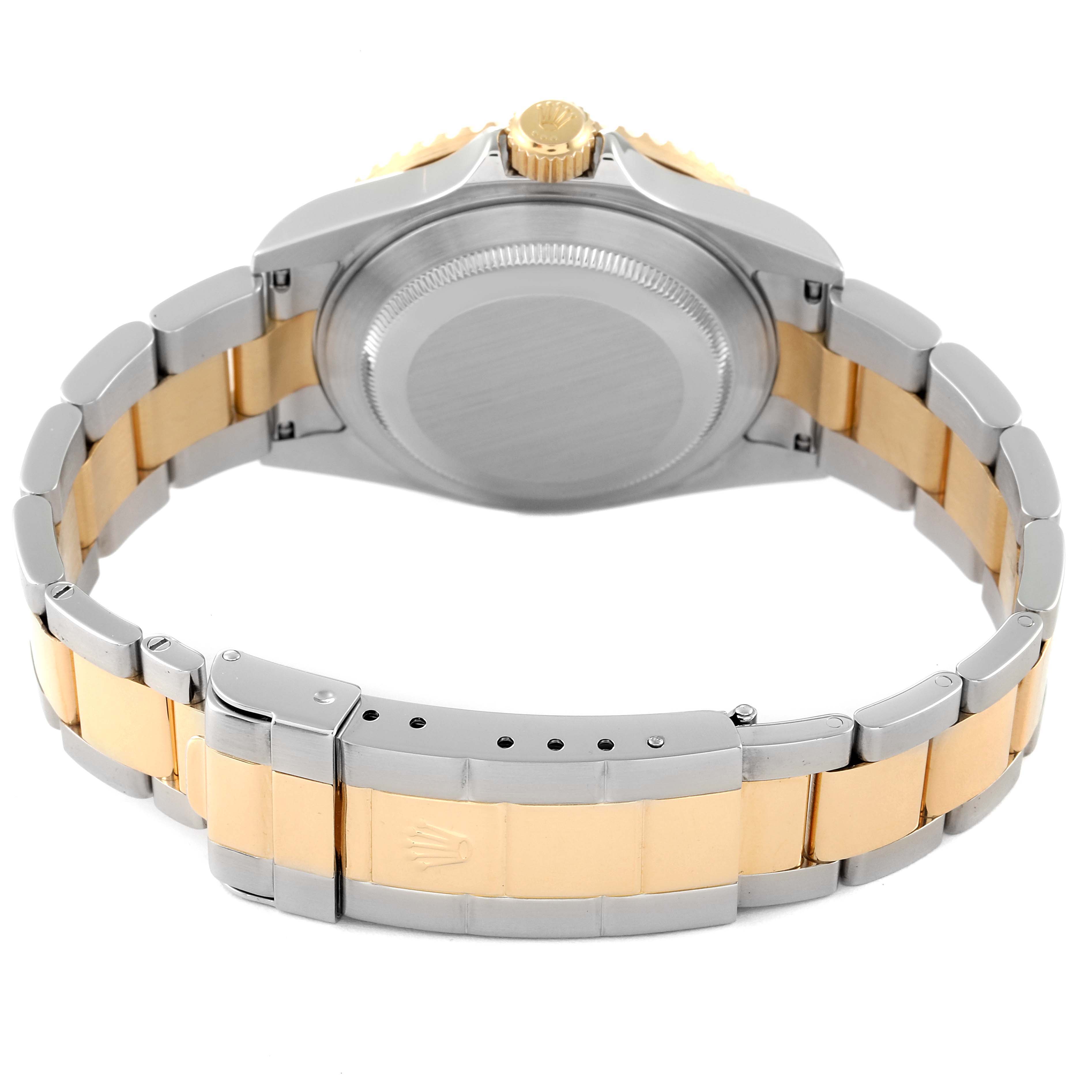 The image shows the back view of the Rolex Submariner 16613 Men's Steel and Gold (two tone) Blue Dial 16613 Men's Steel and Gold (two tone) Blue Dial, highlighting its case and two-tone bracelet.