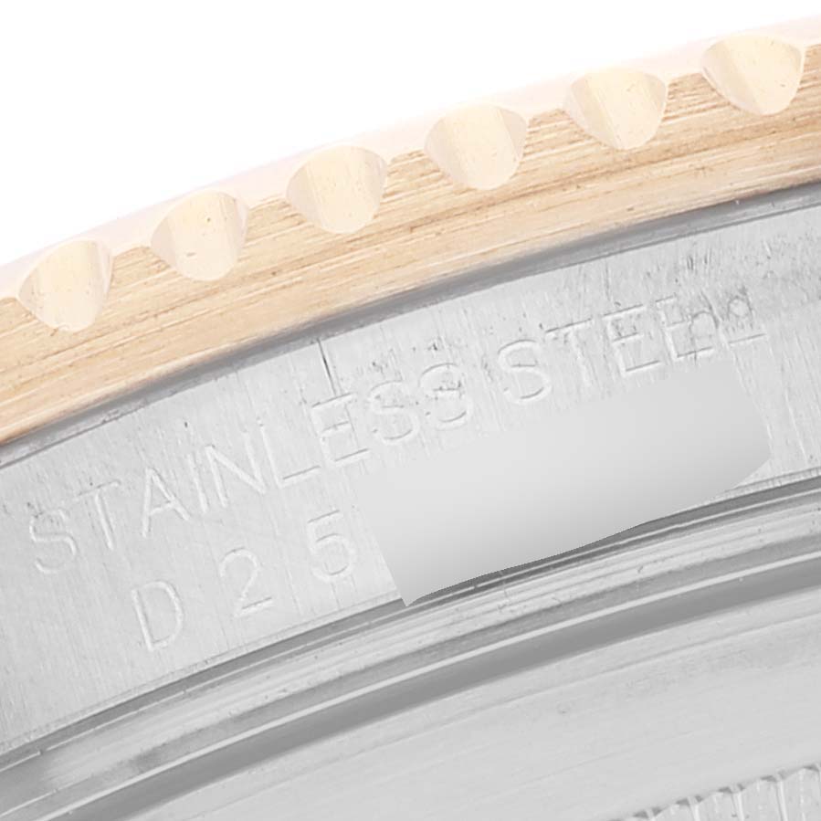 This image shows a close-up of the engraved case back and partially visible bezel of a Rolex Submariner 16613 Men's Steel and Gold (two tone) Blue Dial 16613 Men's Steel and Gold (two tone) Blue Dial watch.