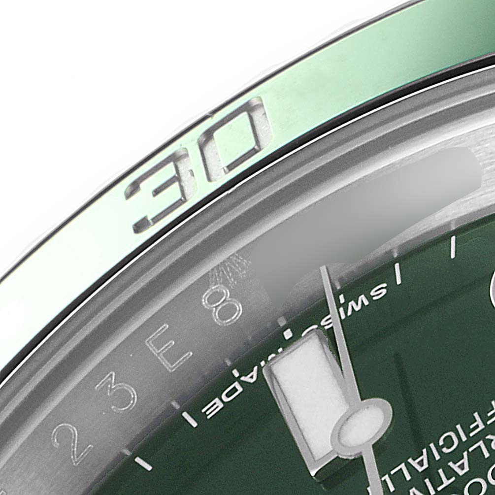 The image shows a close-up of the bezel, minute markings, and a portion of the dial of a Rolex Submariner 116610LV Men's Stainless Steel Green Dial 116610LV Men's Stainless Steel Green Dial watch.
