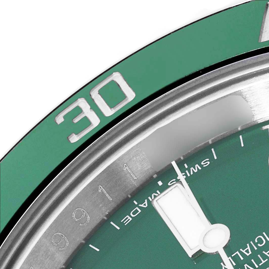 This image shows a close-up of the dial and bezel of a green Rolex Submariner 116610LV Men's Stainless Steel Green Dial 116610LV Men's Stainless Steel Green Dial model, focused on the 30-minute mark.