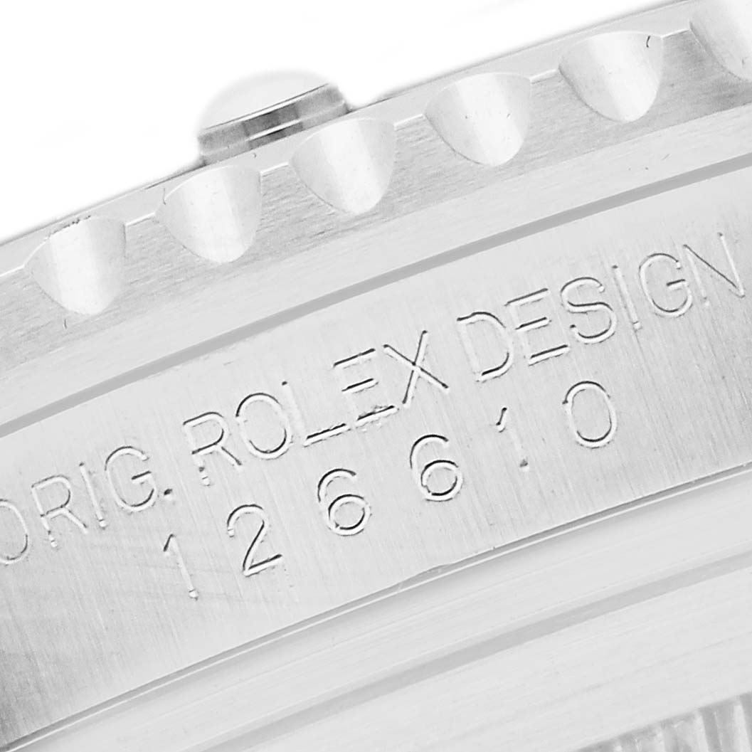 The image shows a close-up of the side of a Rolex Submariner 126610LV Men
s Stainless Steel Black Dial, highlighting its engraved model number and bezel edge.