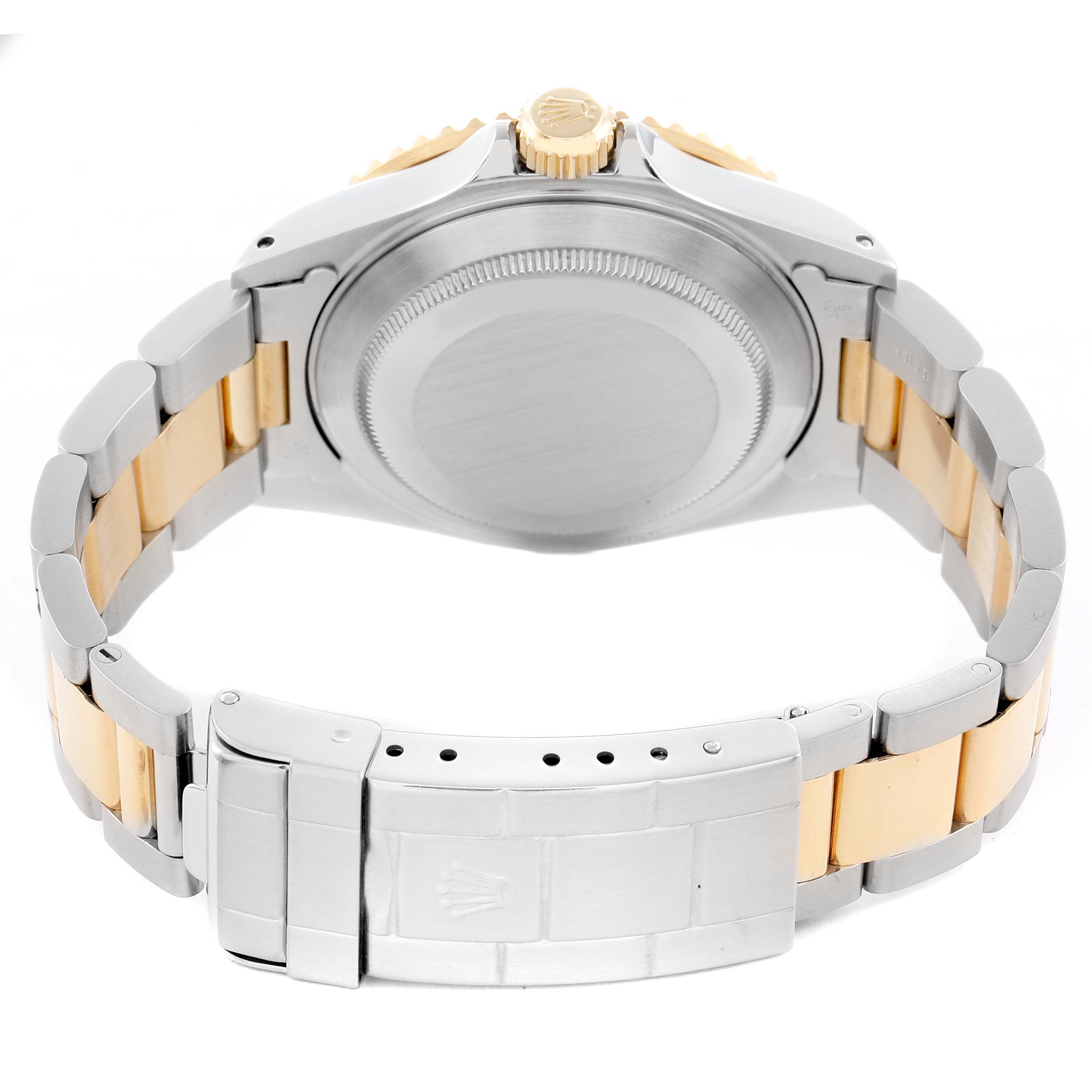 The image shows the back view of a Rolex Submariner 16613 Men
s Steel and Gold (two tone) Champagne Dial, highlighting the case back, crown, and the two-tone bracelet and clasp.