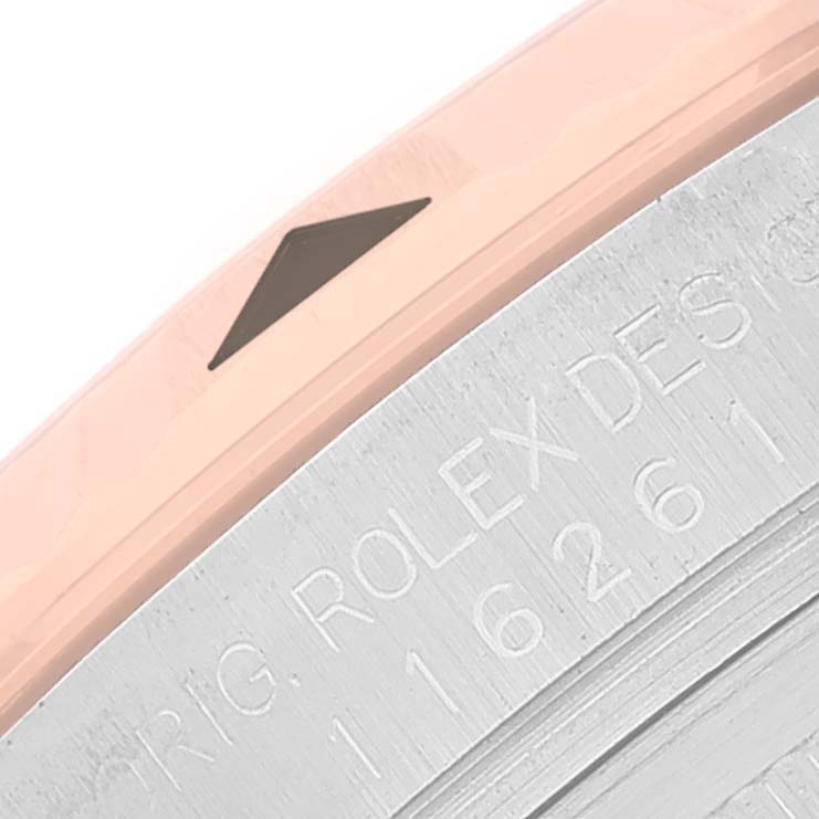 The close-up image shows the bezel and part of the engraved case of a Rolex Turn-o-Graph 116261 Men's Steel and Gold (two tone) White Dial 116261 Men's Steel and Gold (two tone) White Dial watch.