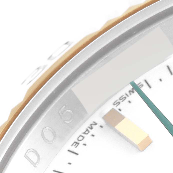 The image shows a close-up of the dial and part of the bezel of a Rolex Turn-o-Graph 116263 Men
s Steel and Gold (two tone) White Dial 116263 Men
s Steel and Gold (two tone) White Dial watch.