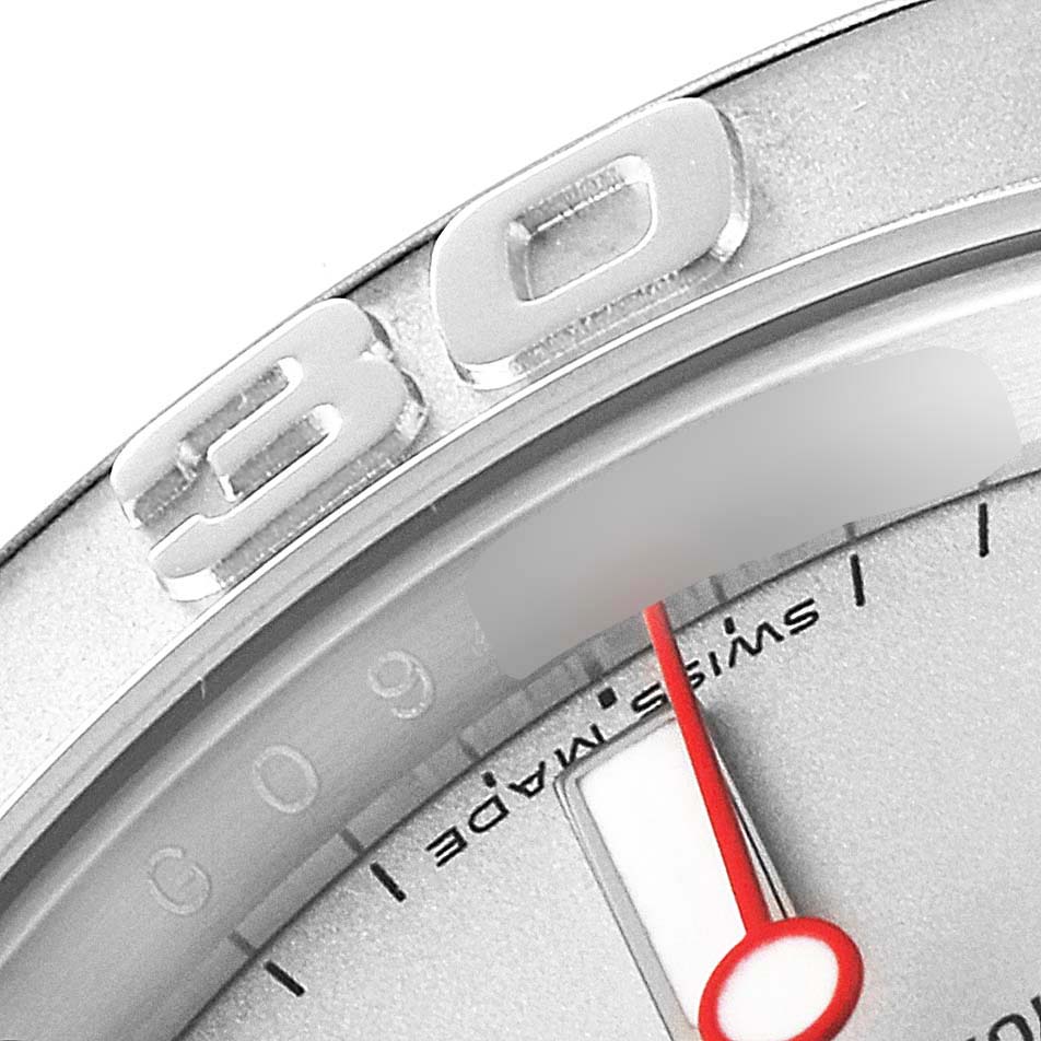 A close-up of the Yacht-Master Rolex watch showing the bezel with the "30" marker and part of the dial with a red hand.