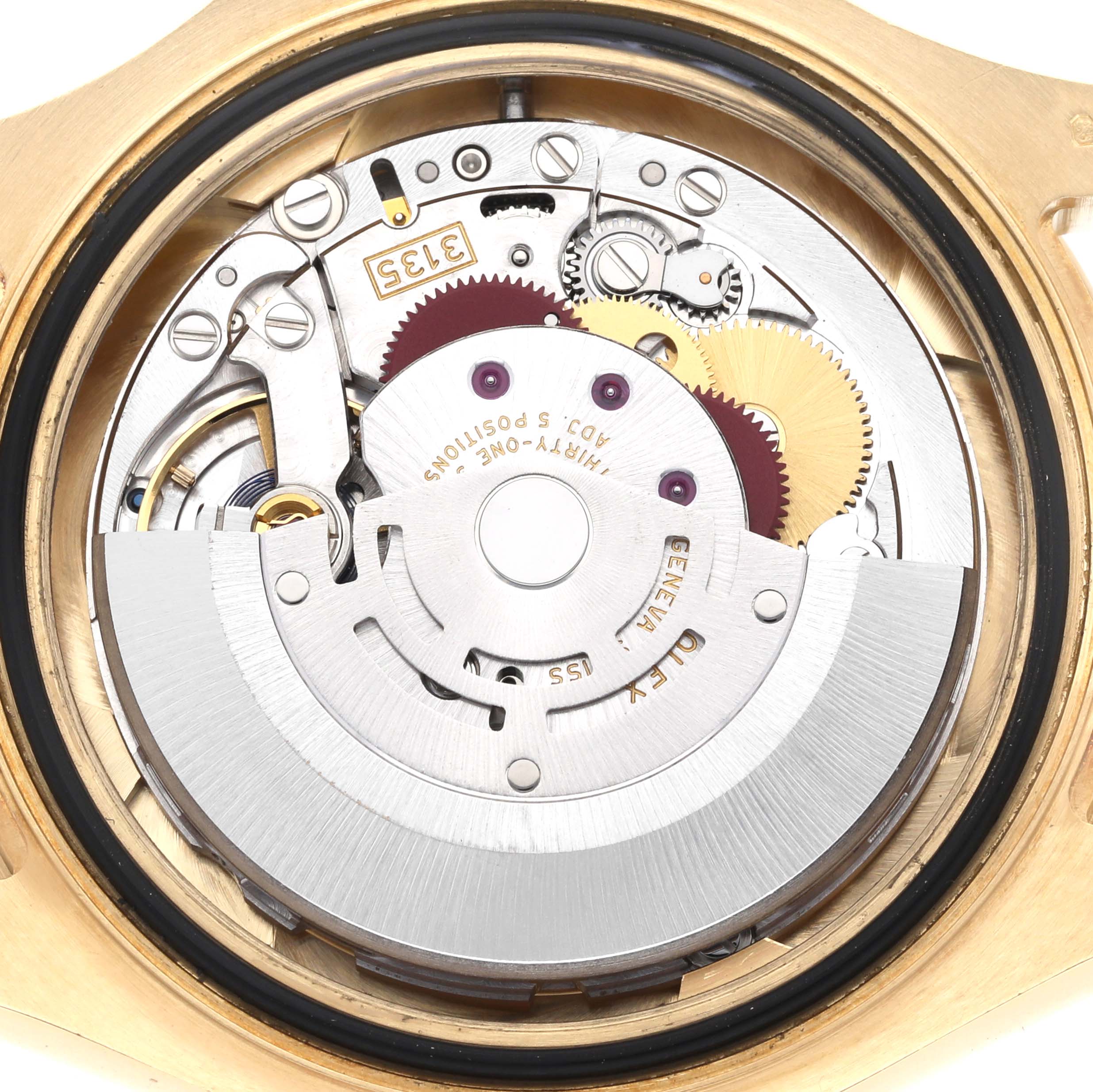 The image shows the Rolex Yacht-Master 16628B Men
s Yellow Gold Mother of Pearl Dial
s movement from the back, highlighting gears, rotor, and mechanisms.