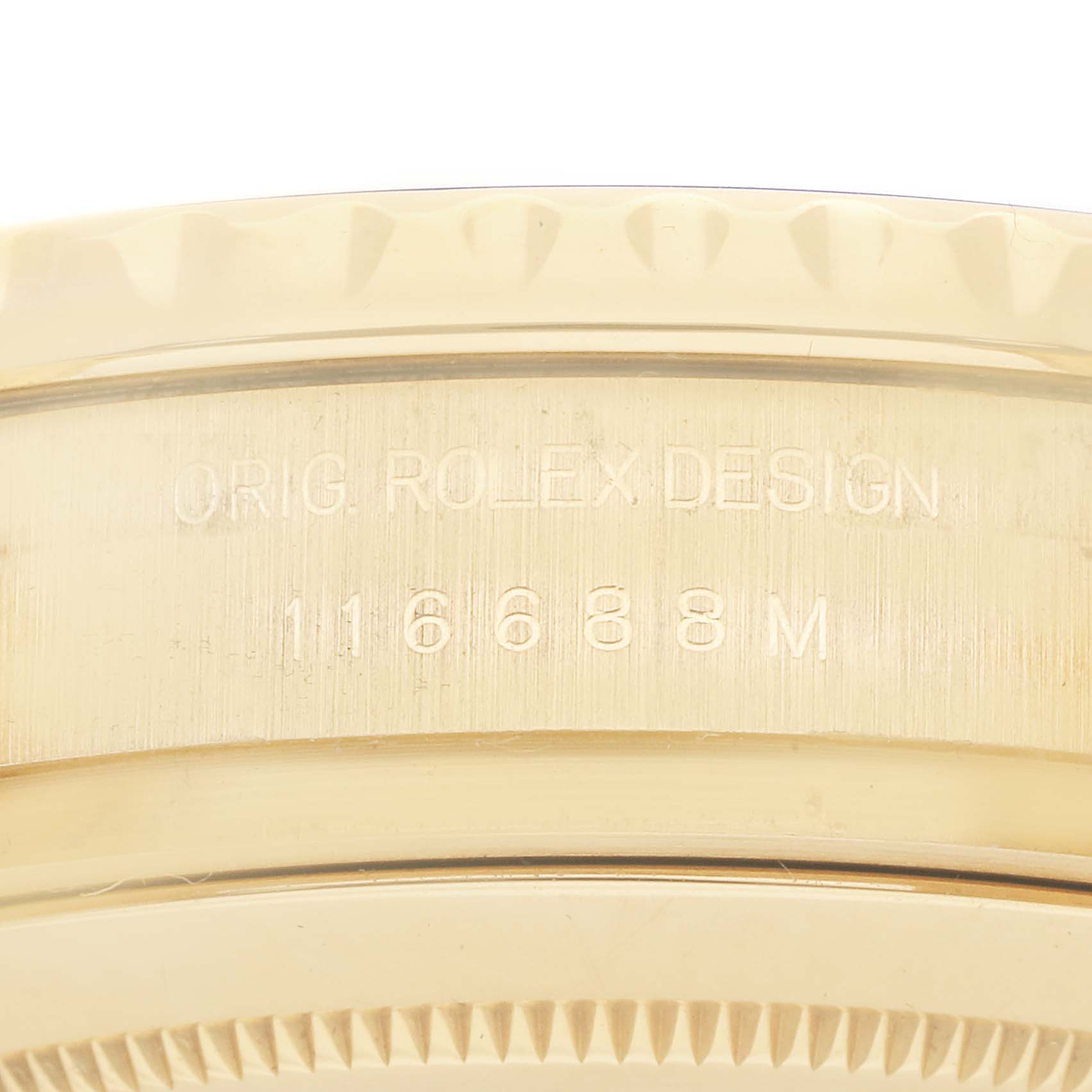 This image shows a close-up of the side engraving on a Rolex Yacht-Master 116688 Men
s Yellow Gold White Dial, displaying the model number and "Orig. Rolex Design".