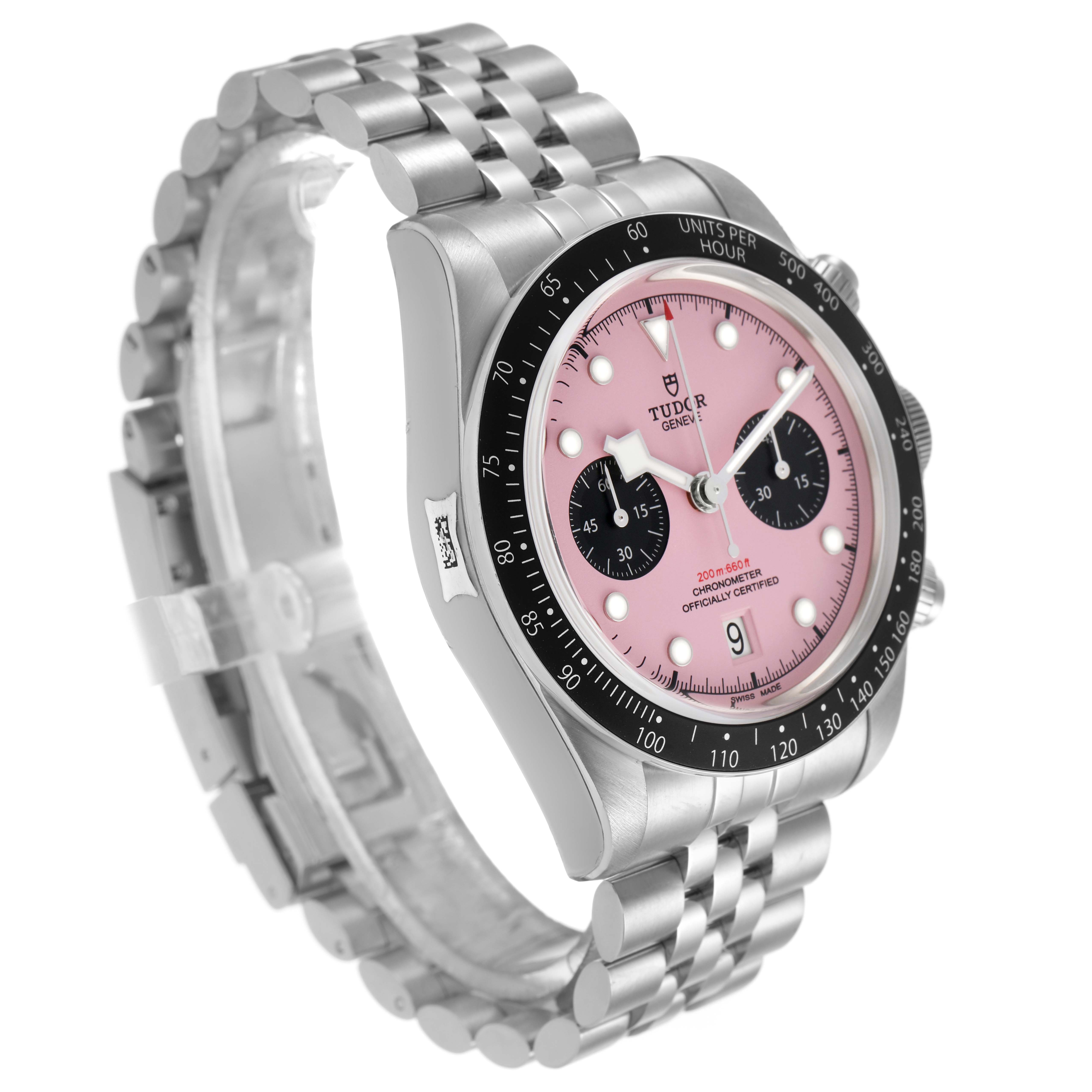 The Tudor Heritage Black Bay M79360N Men's Stainless Steel Pink Dial watch is angled to show the pink dial, bezel, case, and part of the bracelet.