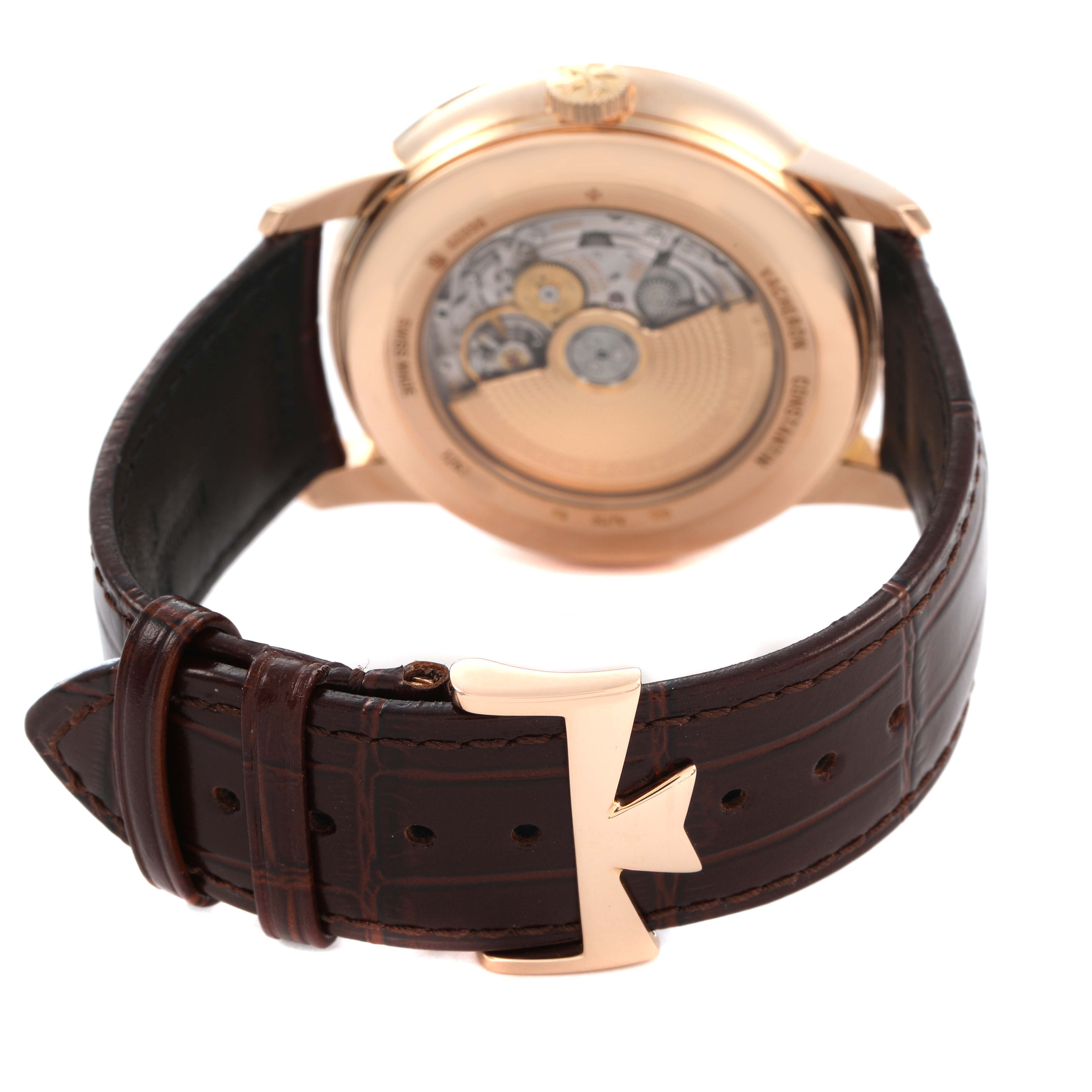 The image shows the back of the Vacheron Constantin Patrimony 86020 Men's Rose Gold Silver Dial watch, highlighting the movement and leather strap with a distinctive buckle.