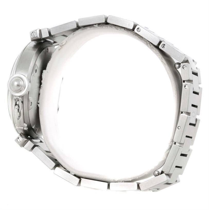 The image shows a side view of a Cartier Pasha W31044M7 Men
s Stainless Steel Silver Dial W31044M7 Men
s Stainless Steel Silver Dial watch, focusing on its bezel and metal bracelet.