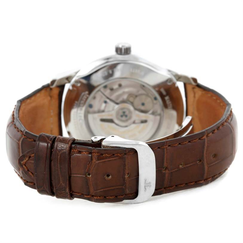 This rear view of the Jaeger LeCoultre Master 146.8.02 Men's Stainless Steel Silver Dial 146.8.02 Men's Stainless Steel Silver Dial model watch shows the brown leather strap and the watch's automatic movement through the case back.