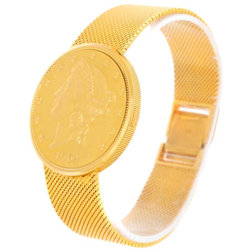 This image shows a Jaeger LeCoultre Vintage 4430 Men's Yellow Gold Silver Dial 4430 Men's Yellow Gold Silver Dial watch from an angled side view, highlighting its gold coin-style dial and mesh strap.