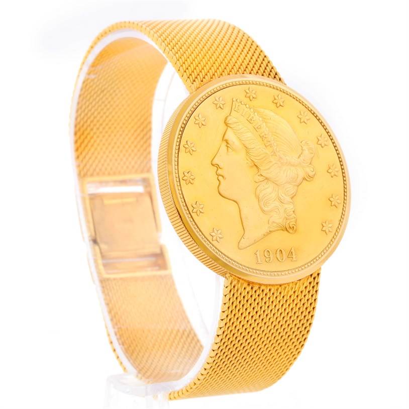 The image shows a vintage Jaeger LeCoultre watch featuring a gold coin-style face and a gold mesh bracelet, viewed from an oblique angle.