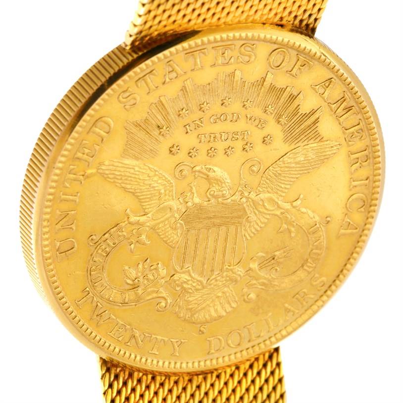 The image shows a close-up of the face and mesh band of a Vintage Jaeger LeCoultre watch featuring a gold coin design.