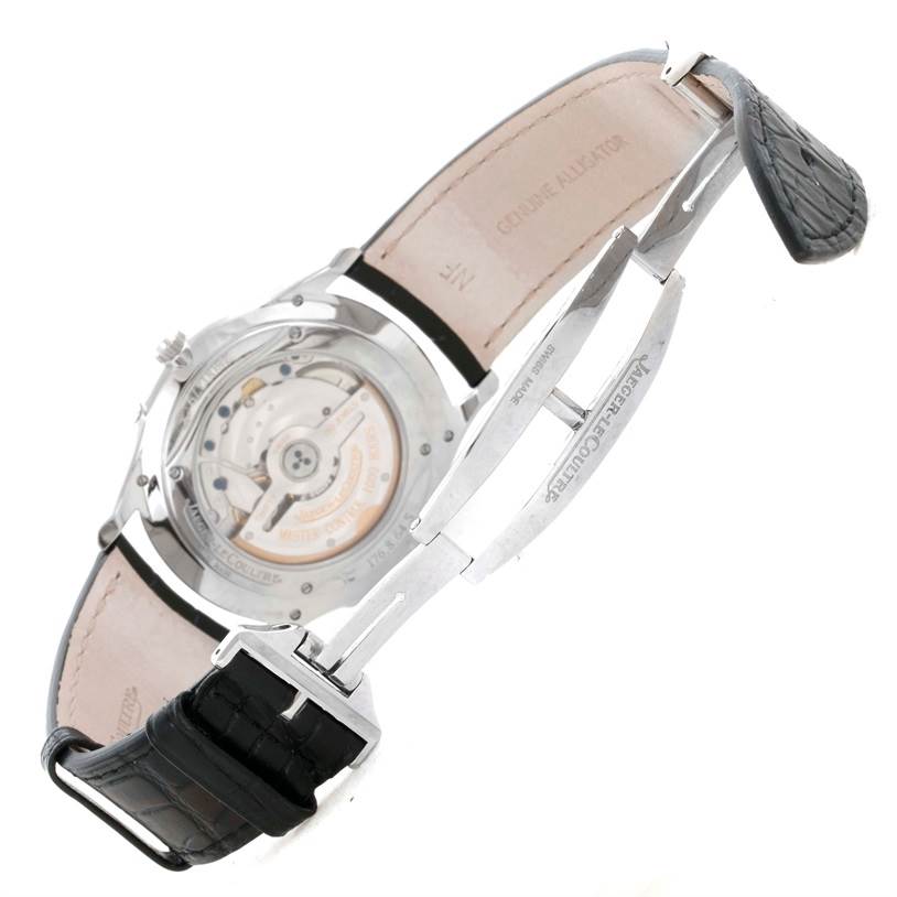 The Jaeger LeCoultre Master Q1368420 Men's Stainless Steel Silver Dial Q1368420 Men's Stainless Steel Silver Dial model watch is shown from the back, displaying its movement, clasp, and alligator leather strap.