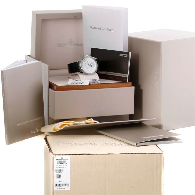 The Jaeger LeCoultre Master Q1368420 Men's Stainless Steel Silver Dial Q1368420 Men's Stainless Steel Silver Dial model watch is shown from a front angle with accompanying box, manuals, and guarantee certificate.