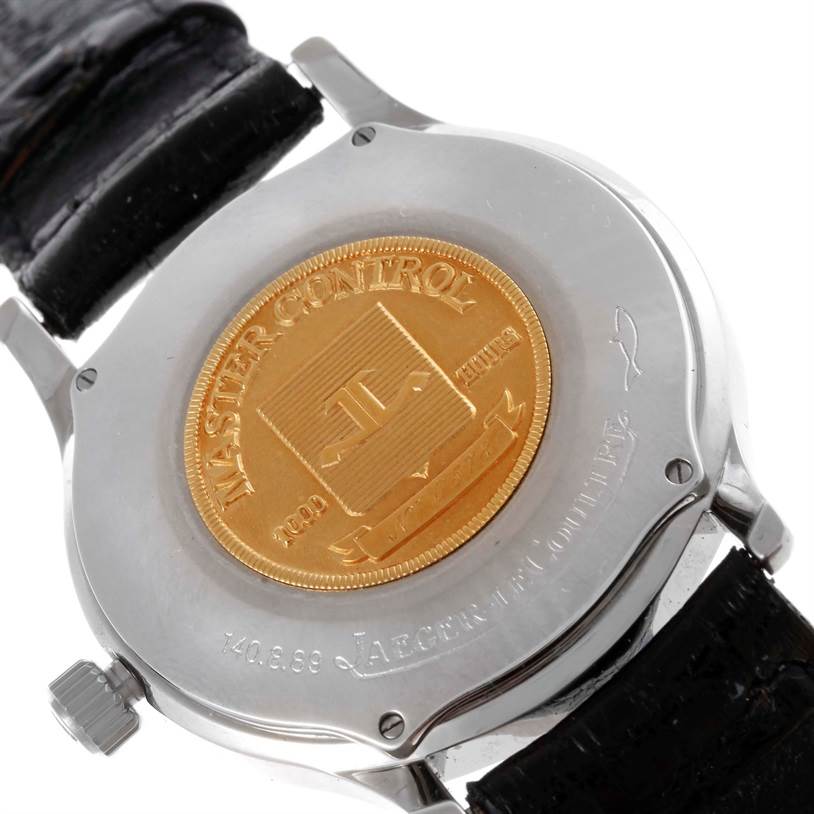 The image shows the Jaeger LeCoultre Master 140.8.89 Men
s Steel and Gold (two tone) Silver Dial 140.8.89 Men
s Steel and Gold (two tone) Silver Dial model watch
s case back, showcasing the engraved details and leather strap.