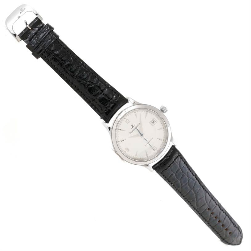 The Jaeger LeCoultre Master 140.8.89 Men
s Steel and Gold (two tone) Silver Dial 140.8.89 Men
s Steel and Gold (two tone) Silver Dial model watch is shown from a top-down angle, featuring its face, bezel, crown, and black leather strap.