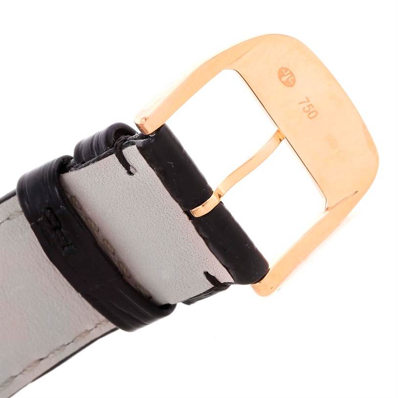 This image shows a close-up of the gold buckle and leather strap of a Jaeger LeCoultre Reverso Q2782520 Men's Rose Gold Silver Dial Q2782520 Men's Rose Gold Silver Dial watch.