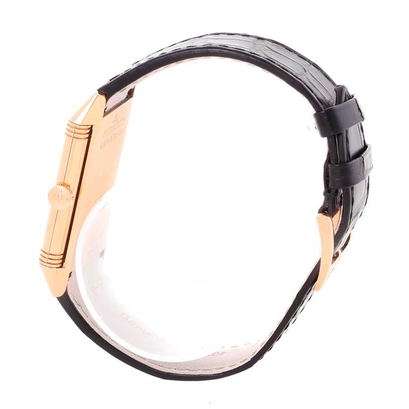 Side profile of the Jaeger LeCoultre Reverso Q2782520 Men's Rose Gold Silver Dial Q2782520 Men's Rose Gold Silver Dial watch showing the crown and leather strap.