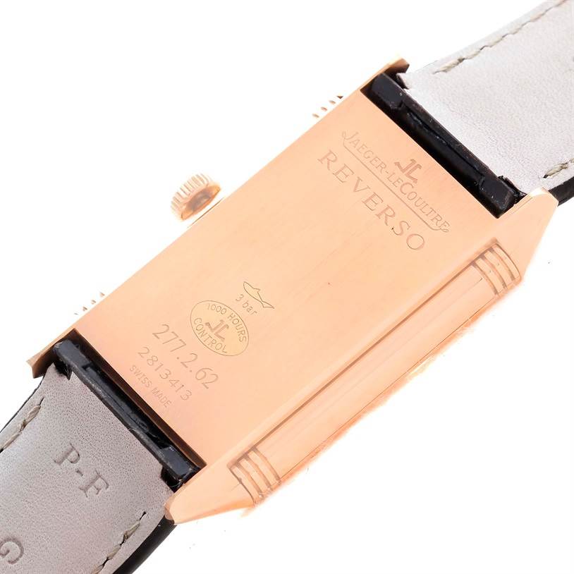 The image shows the case back and strap of a Jaeger LeCoultre Reverso Q2782520 Men's Rose Gold Silver Dial Q2782520 Men's Rose Gold Silver Dial model, viewed from a top-down angle.