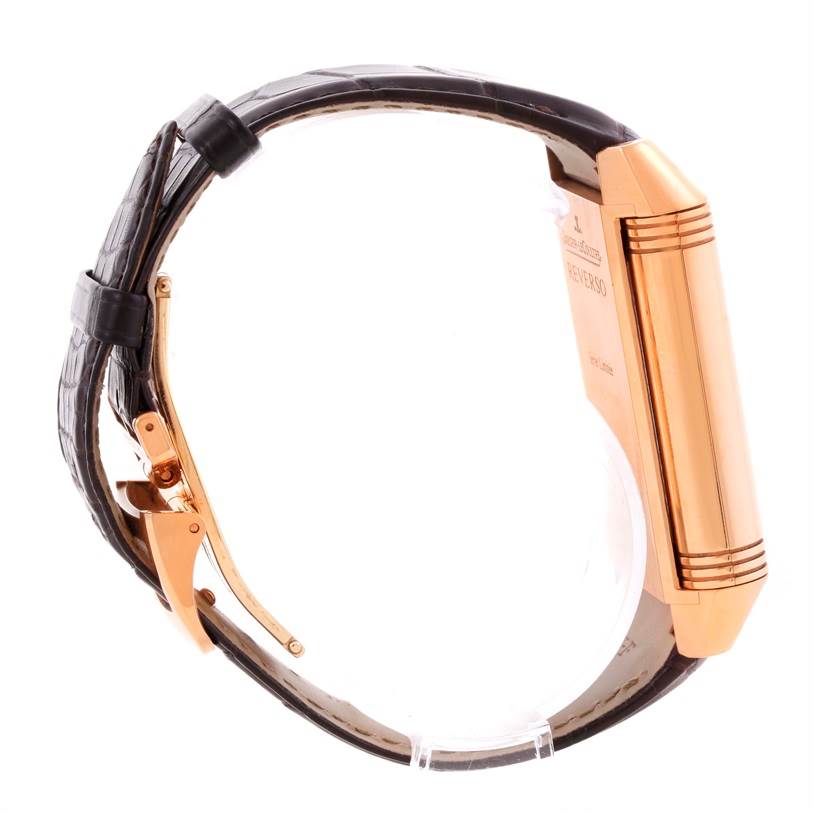 The image shows a side view of the Jaeger-LeCoultre Reverso watch, highlighting the strap, clasp, and case back.