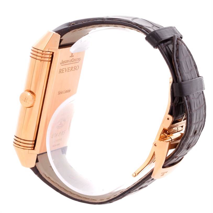 This image shows the side view of a Jaeger LeCoultre Reverso Q3742421 Men's Rose Gold Silver Dial Q3742421 Men's Rose Gold Silver Dial watch, focusing on the case, crown, and leather strap.