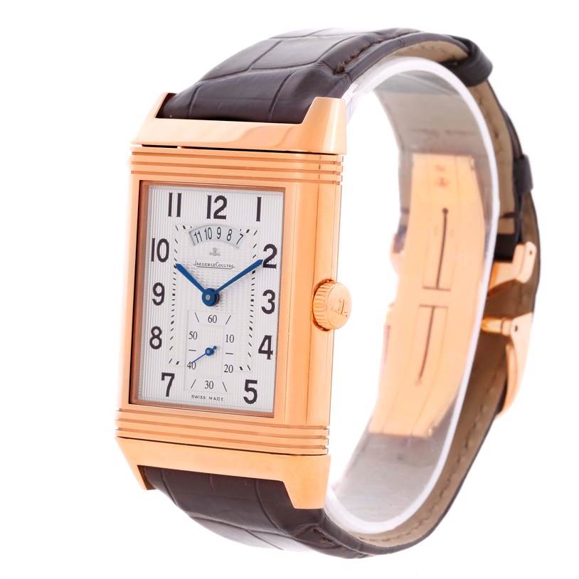This image displays a Jaeger LeCoultre Reverso Q3742421 Men's Rose Gold Silver Dial Q3742421 Men's Rose Gold Silver Dial model watch at an angle showing the front face, crown, and part of the strap.