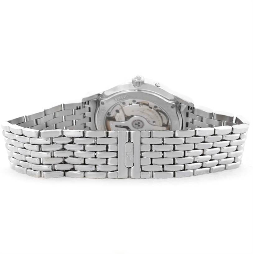 The image shows the back view of a Jaeger-LeCoultre Master model watch, highlighting the stainless steel bracelet and the exhibition caseback.