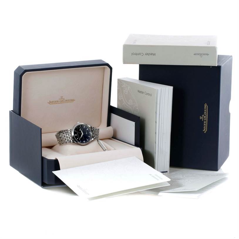 The image shows a Jaeger LeCoultre Master 140.8.93.S Men's Stainless Steel Black Dial 140.8.93.S Men's Stainless Steel Black Dial model watch displayed in its box, along with associated manuals and packaging.