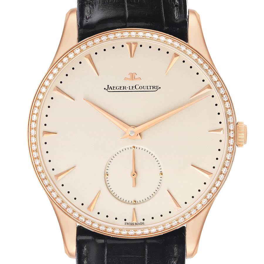 The Jaeger-LeCoultre Master watch is shown from a front angle, highlighting its dial, bezel, black strap, and crown.