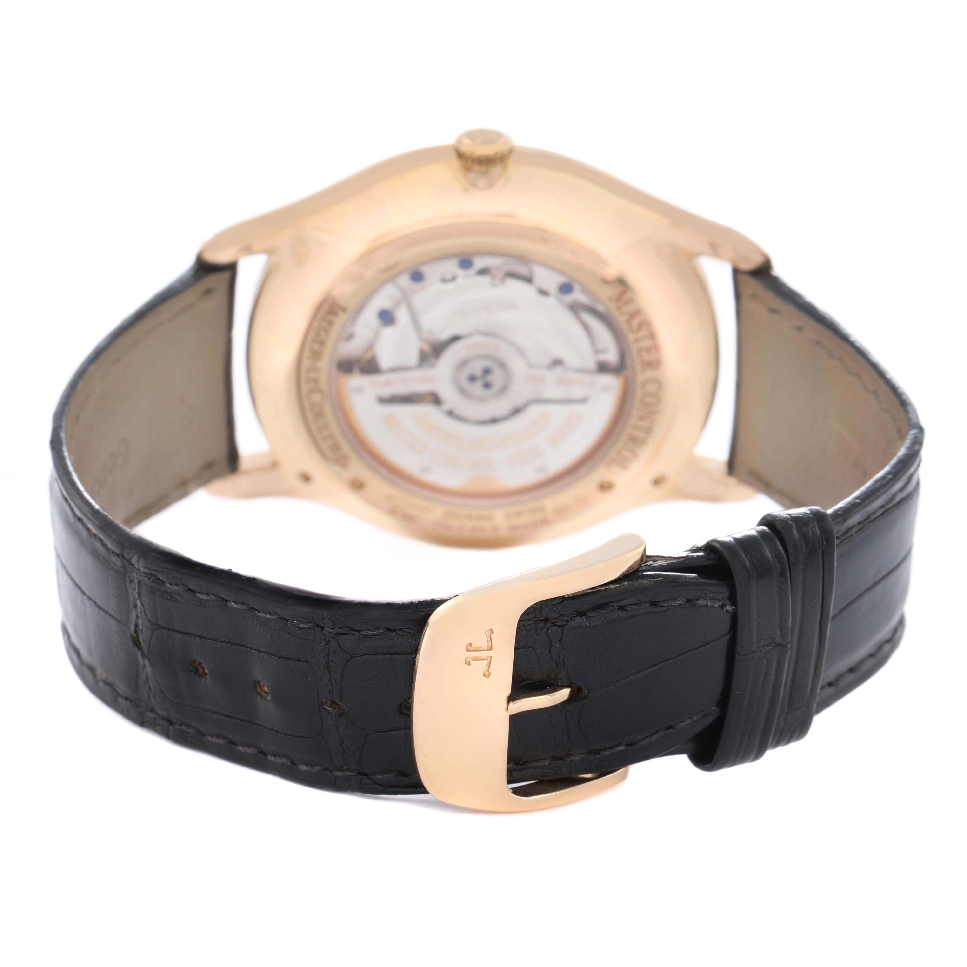 The Jaeger LeCoultre Master Q1352502 Men's Rose Gold Beige Dial watch is shown from the back, highlighting the movement through the case back and the clasp.
