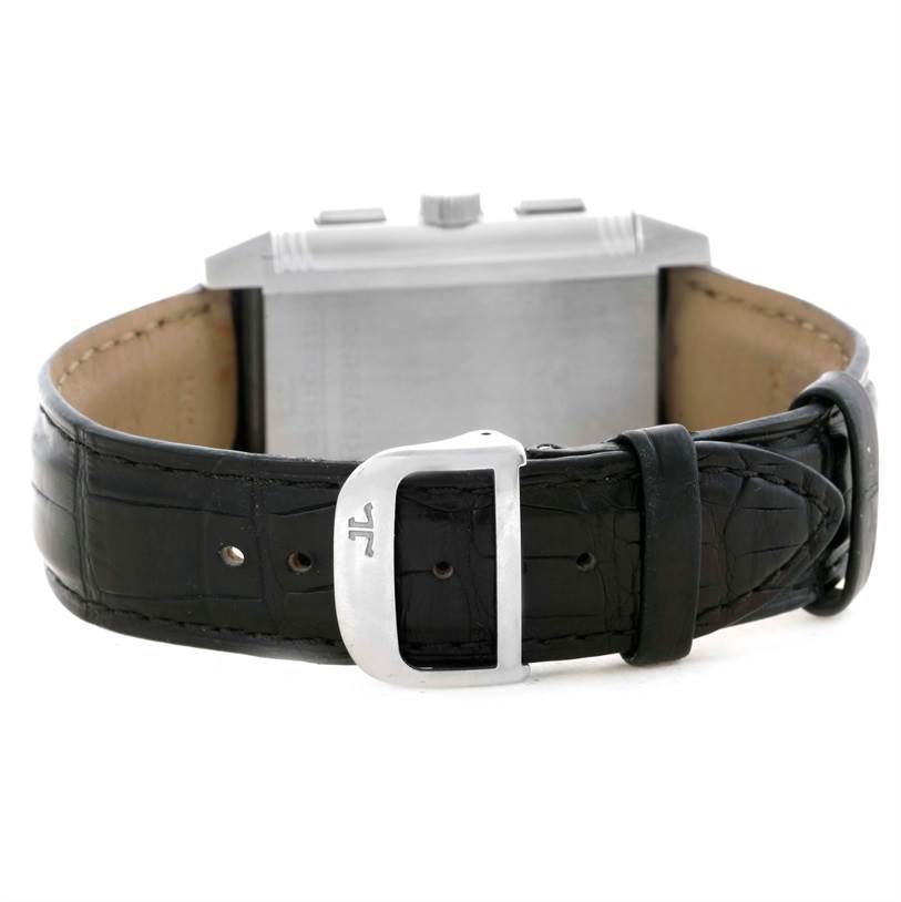 This image shows the back angle of a Jaeger LeCoultre Reverso Q3028420 Men's Stainless Steel Silver Dial Q3028420 Men's Stainless Steel Silver Dial watch with its black leather strap and metal buckle.