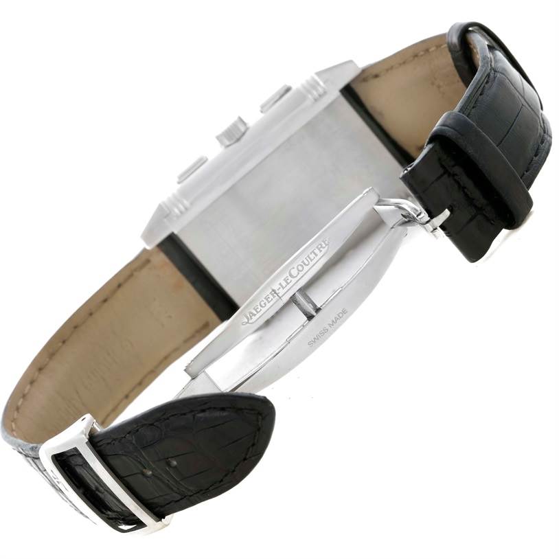 This image shows the side and back of the Reverso model by Jaeger LeCoultre, including its black leather strap and clasp.