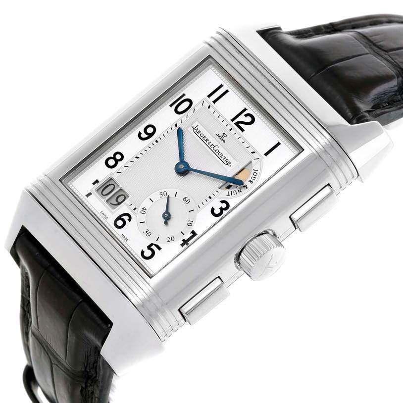 The image shows a close-up, angled view of a Jaeger-LeCoultre Reverso watch displaying the dial and crown.