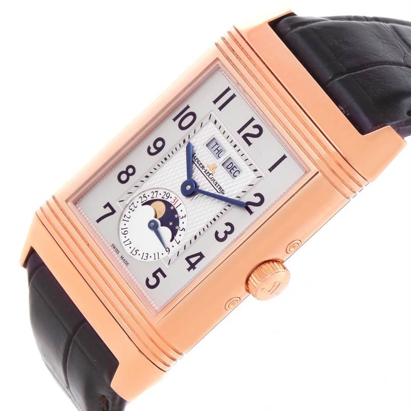 This is a close-up angled view of the dial and crown of a Jaeger-LeCoultre Reverso watch.