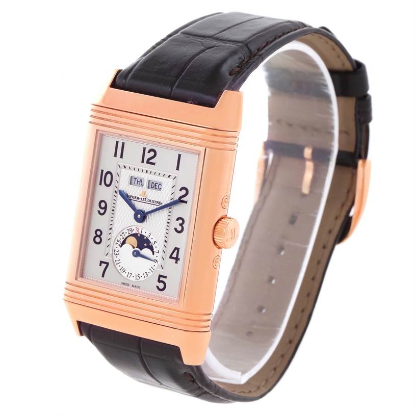 This Jaeger LeCoultre Reverso Q3752520 Men's Rose Gold Silver Dial Q3752520 Men's Rose Gold Silver Dial watch is shown at an oblique angle highlighting its rectangular dial, leather strap, and side crown.