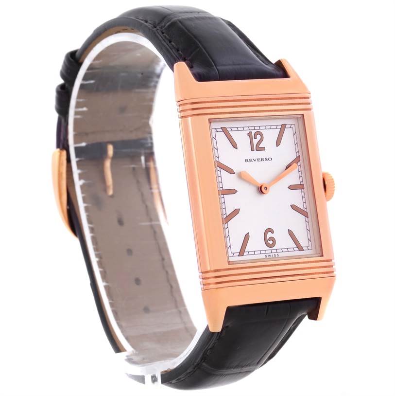 The image shows a Jaeger LeCoultre Reverso Q2782521 Men's Rose Gold White Dial Q2782521 Men's Rose Gold White Dial watch at a slight angle, highlighting its rectangular face and black leather strap.