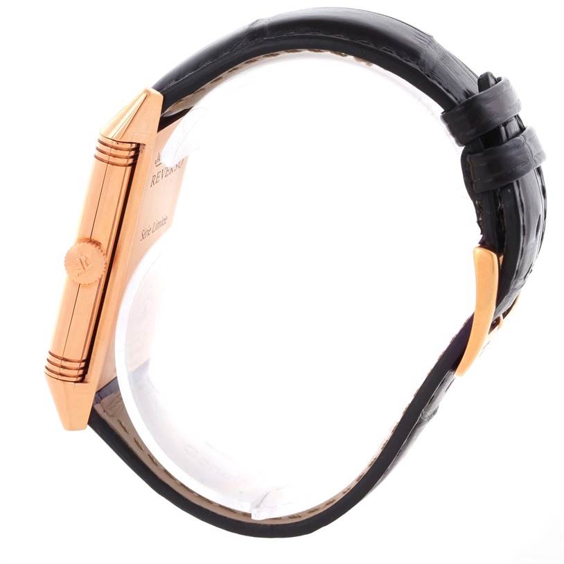 The image shows a side profile of the Jaeger-LeCoultre Reverso watch, highlighting the crown and strap.