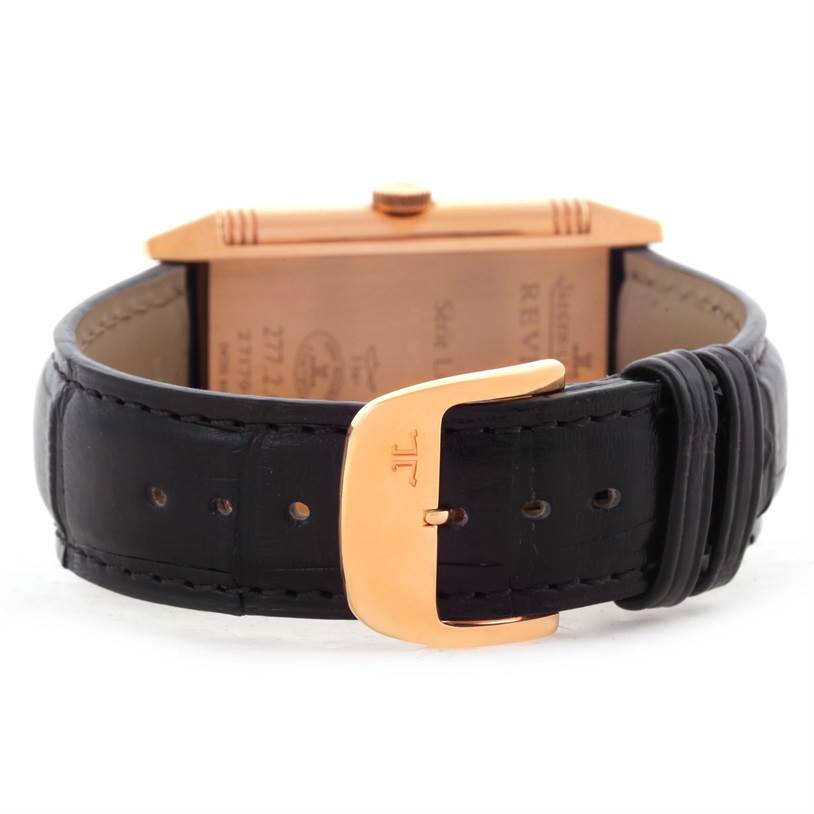 This image shows the back and clasp of a Jaeger-LeCoultre Reverso watch with a black leather strap.