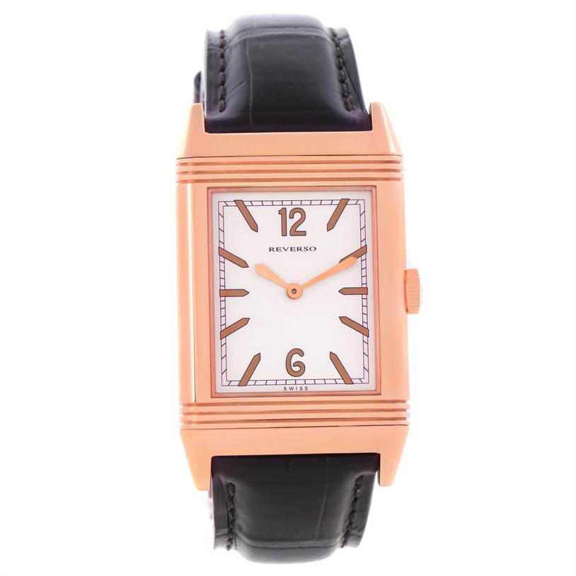 The image shows a frontal view of a Jaeger LeCoultre Reverso Q2782521 Men's Rose Gold White Dial Q2782521 Men's Rose Gold White Dial watch, highlighting its rectangular face and leather strap.