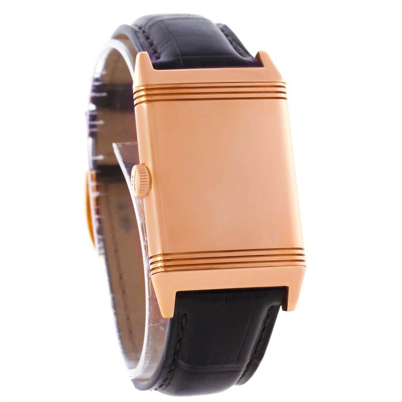 The image shows a Jaeger LeCoultre Reverso Q2782521 Men's Rose Gold White Dial Q2782521 Men's Rose Gold White Dial watch from a front angle, highlighting its gold case and black leather strap.
